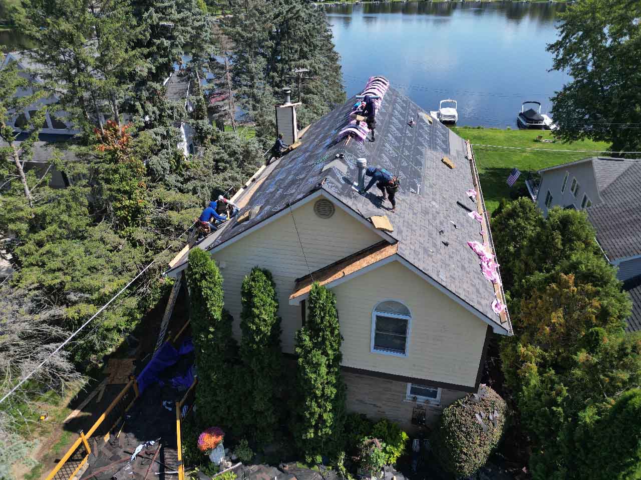 Pure Energy Roofing Company replacing the roof on a lake house in Waterford Township, Michigan